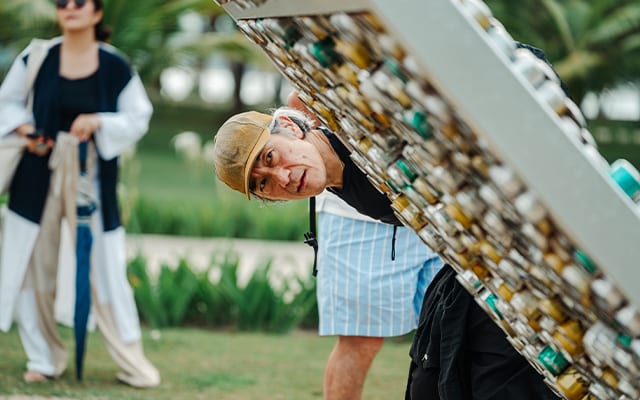 Curious guests take a closer look at the art pieces in the Lubi Art Project.