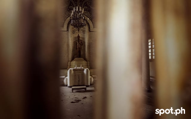 A peek inside one of the old and locked up mausoleums at the Manila Chinese Cemetery..