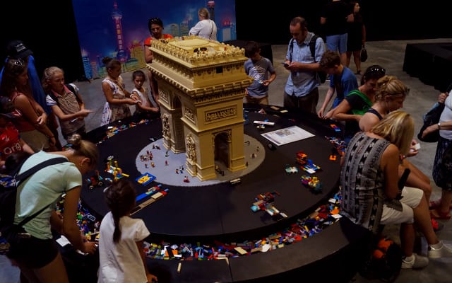 Kids and adults building with LEGO
