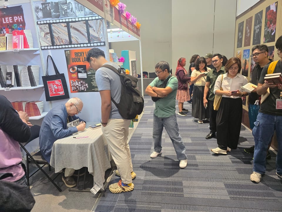 National Artist for Film and Broadcast Arts Ricky Lee signs books at last year's MIBF