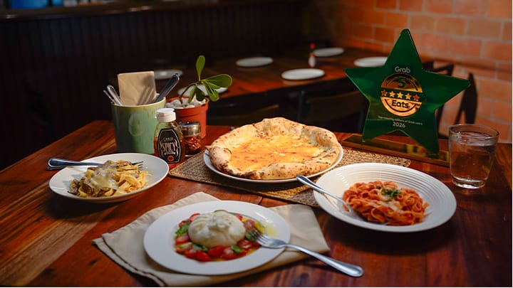 Pizza and pasta on table